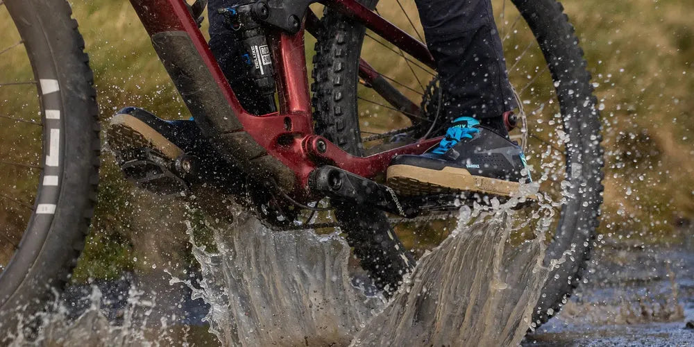 Pin-Lock MTB Shoe in Aloha colorway on a flat pedal with visible pins for wet and muddy trail riding